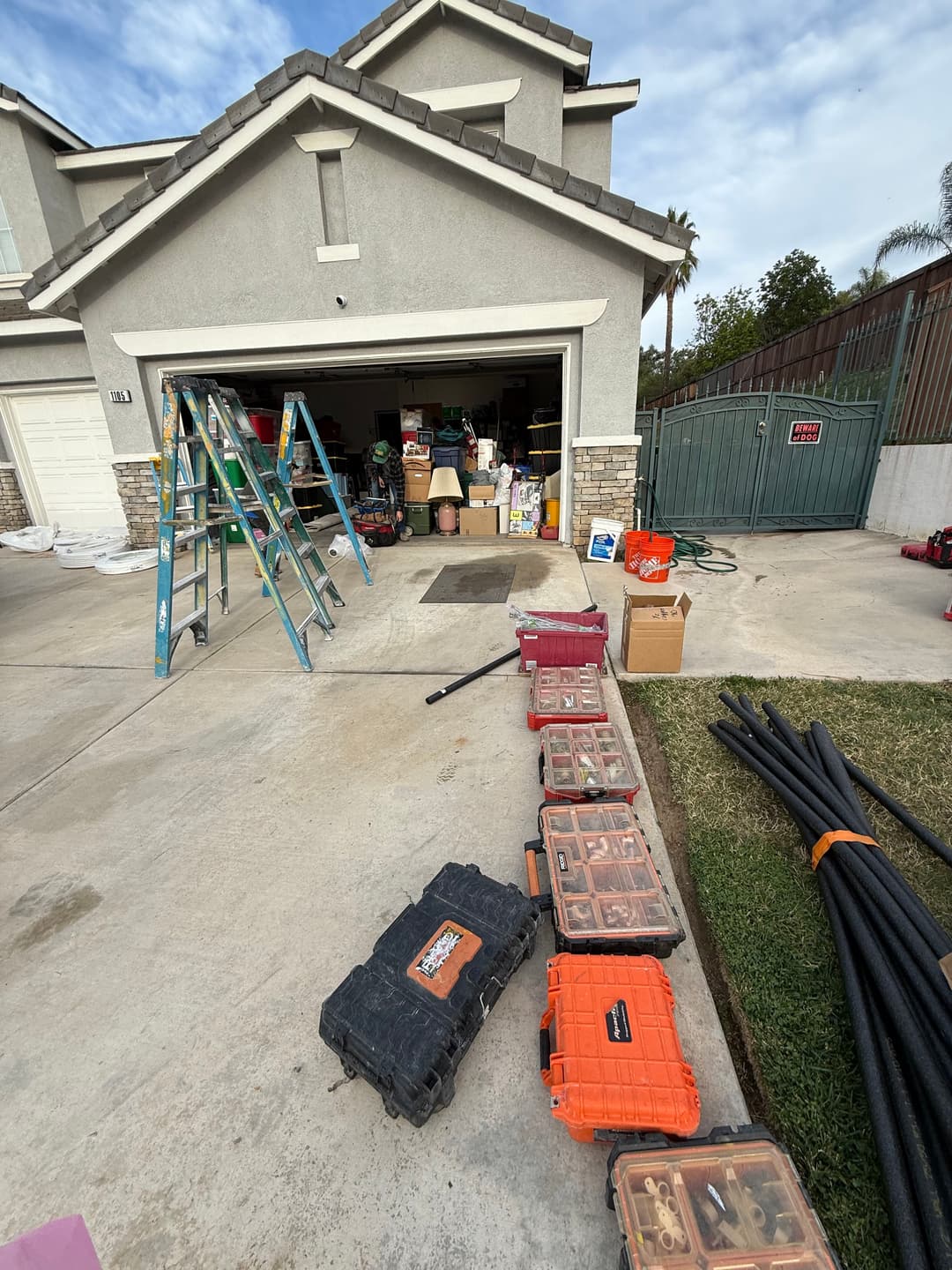 Home garage filled with organized tools, equipment, and ladders ready for a DIY project.